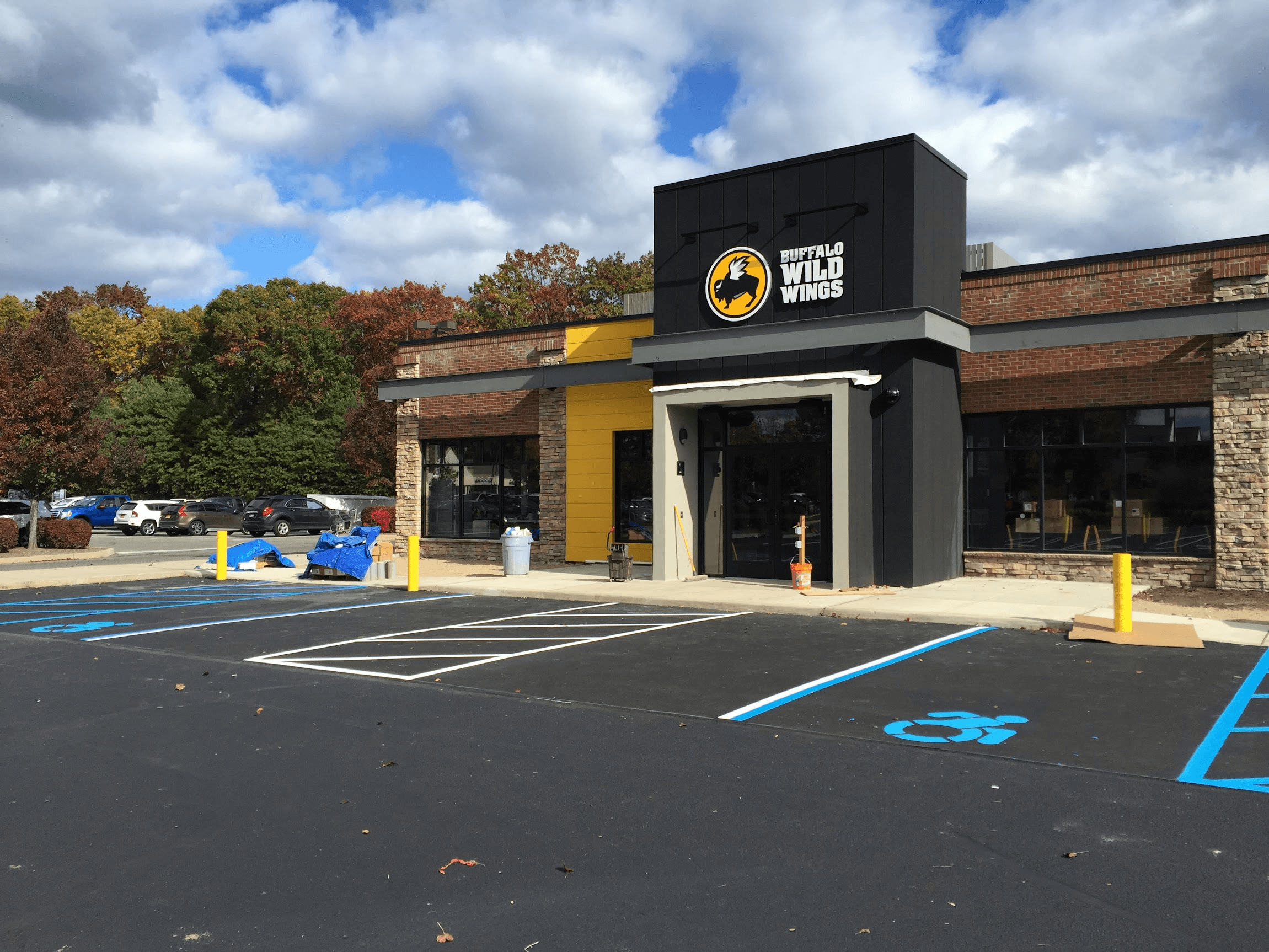 A Buffalo Wild Wings restaurant with a modern facade and parking lot.